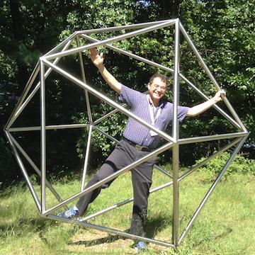 Jesús De Loera standing inside icosahedron made of tubes